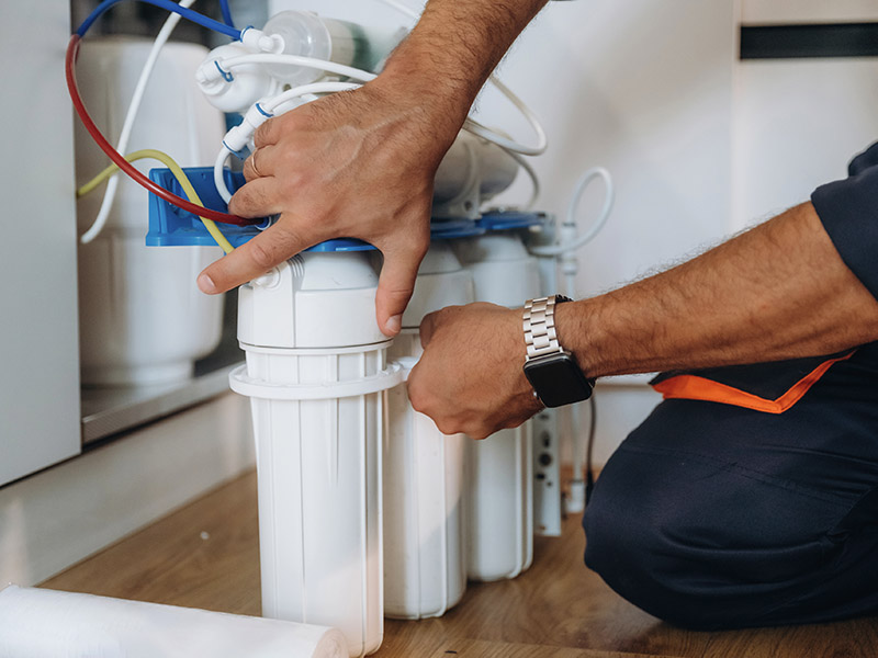 Technician installing RO system